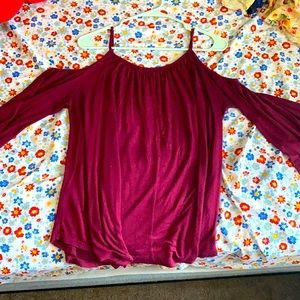Small, woman’s “Ginger G” brand blouse.